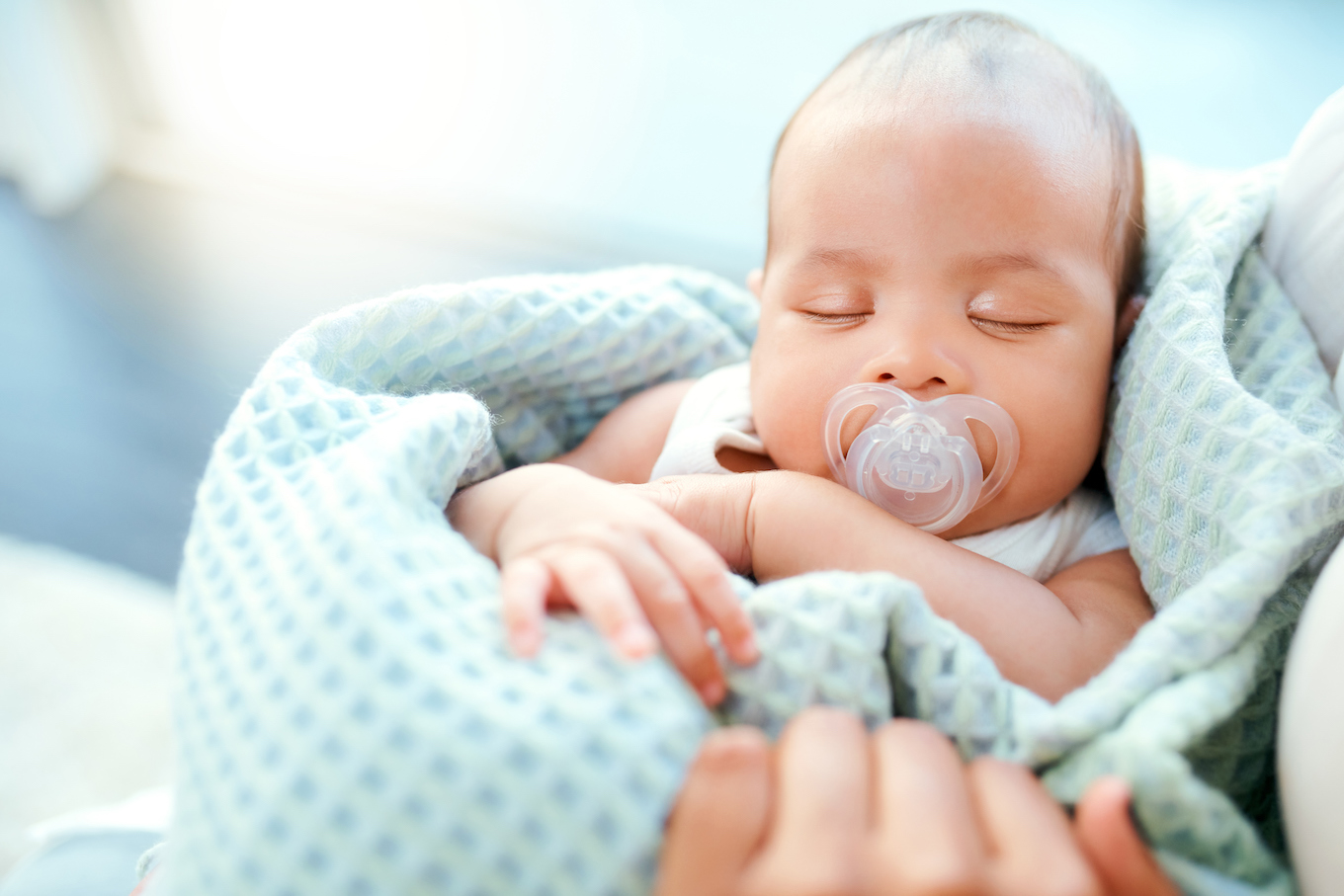 Baby with pacifier sleeping