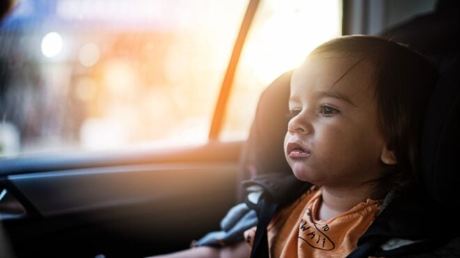 Kid in the backseat of a car