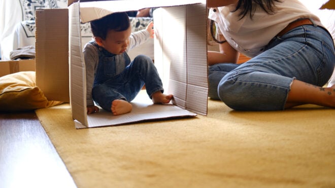 kid playing in box