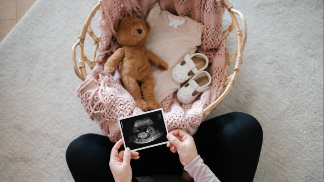 A woman looking at an ultrasound scan