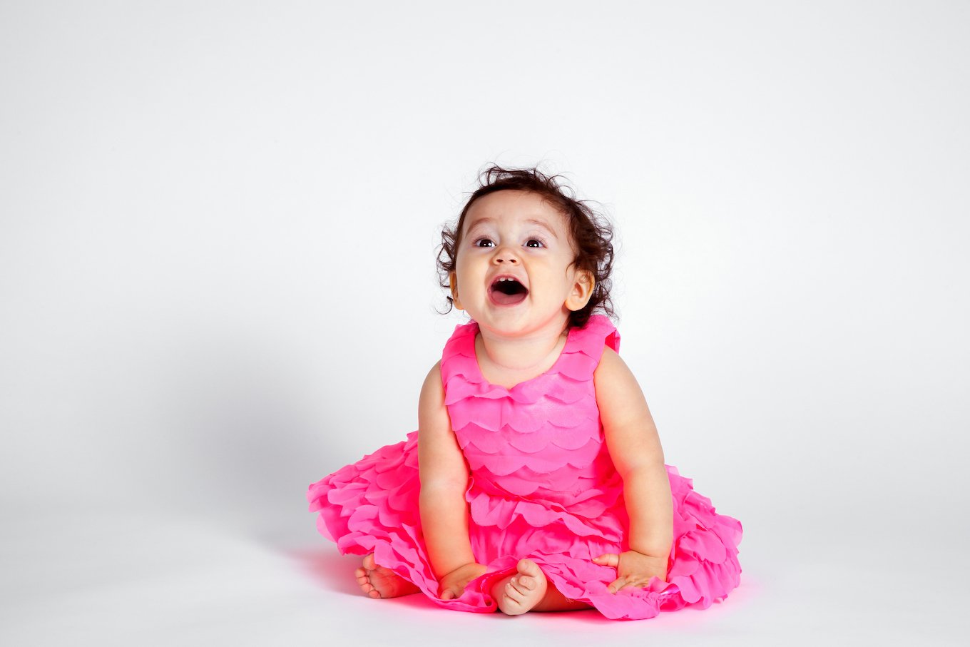 baby girl in a pink dress