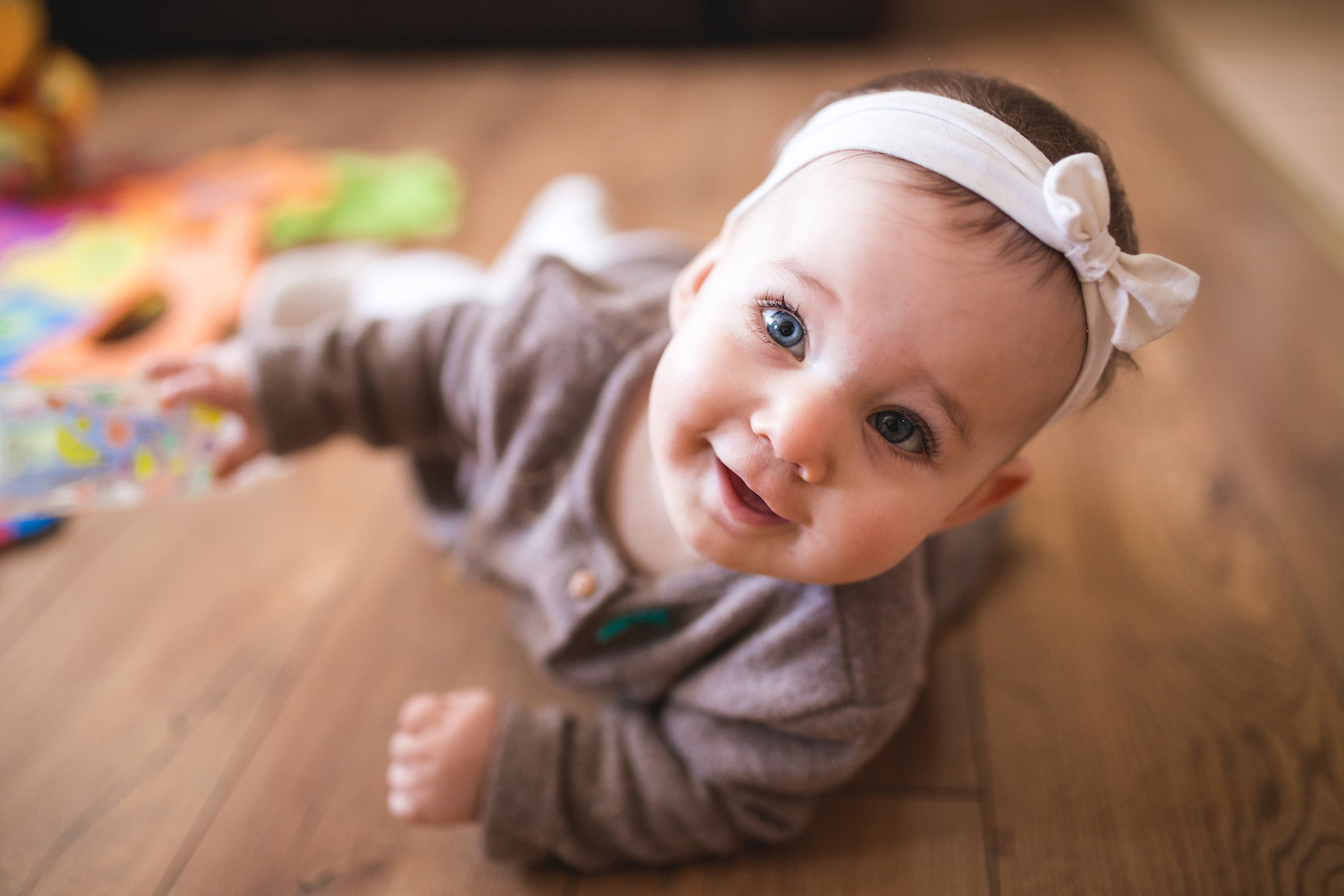 Cute Baby Girl Crawling In Living Room