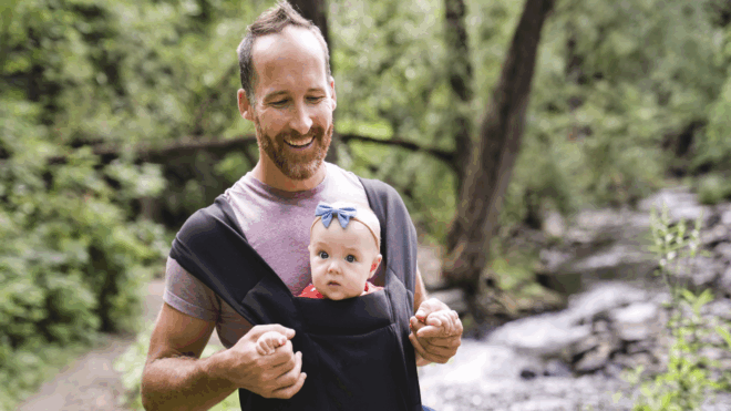 Dad baby-wearing outside