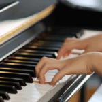 girl learns piano