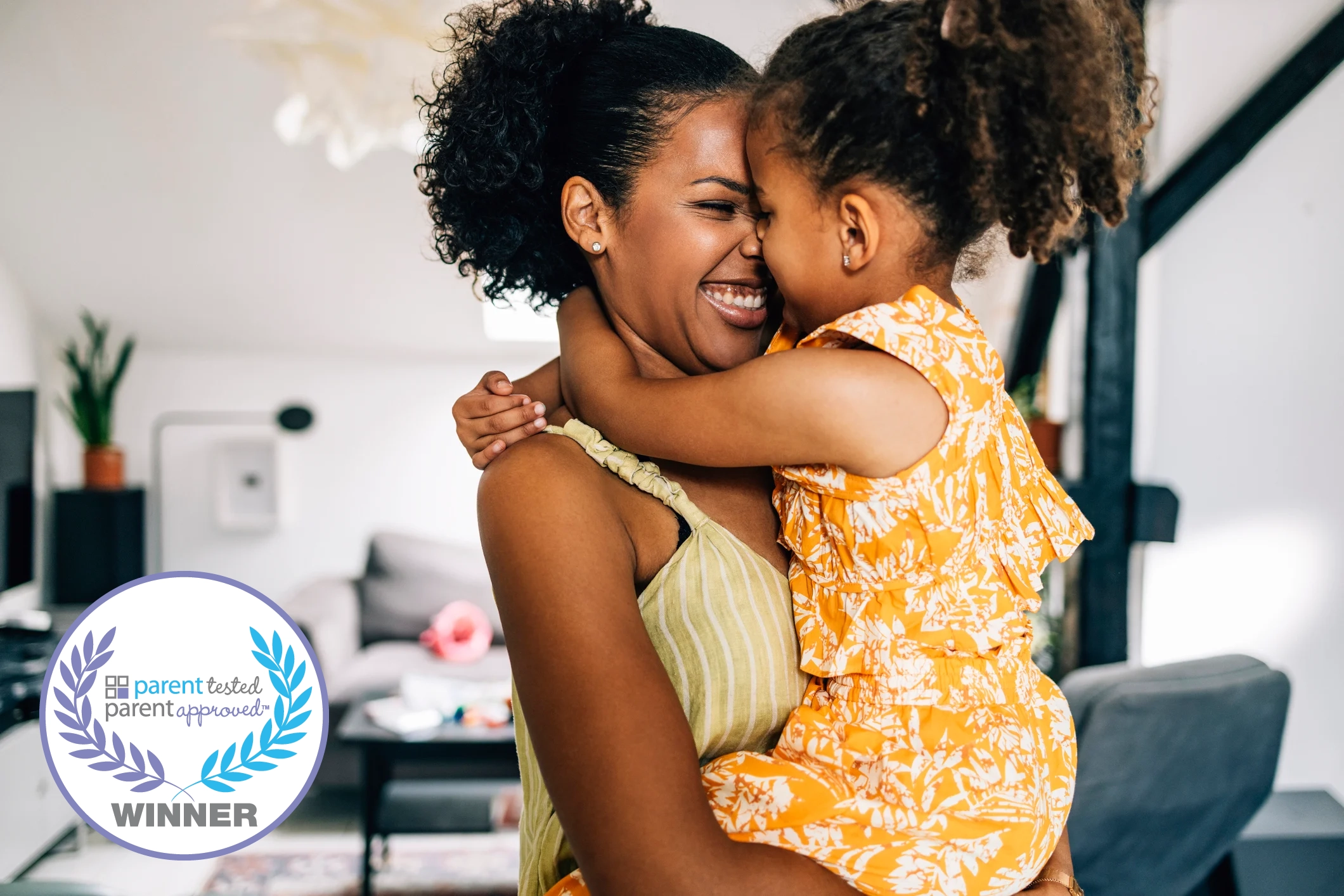 mom carrying toddler or preschool age daughter